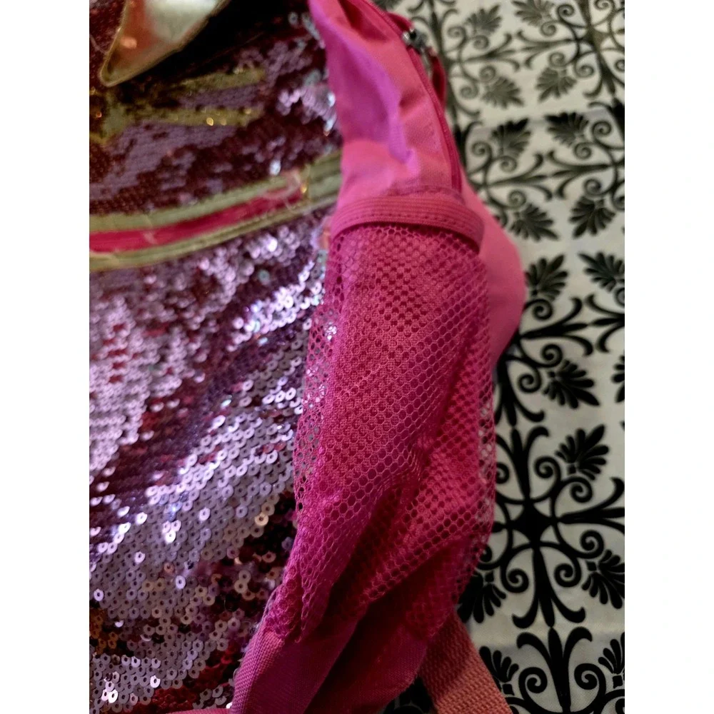 Bright pink sequin backpack. Gold Cat ears matching gold. Good. Few Minor Flaws.